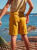 Mustard shorts with multicoloured shark fin embroideries KLOMUAGE / 24E3PGS1BERB107