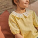 Child girl vanilla blouse with puffed sleeves and embroidered collar