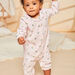 Pink romper with gingham and flower print