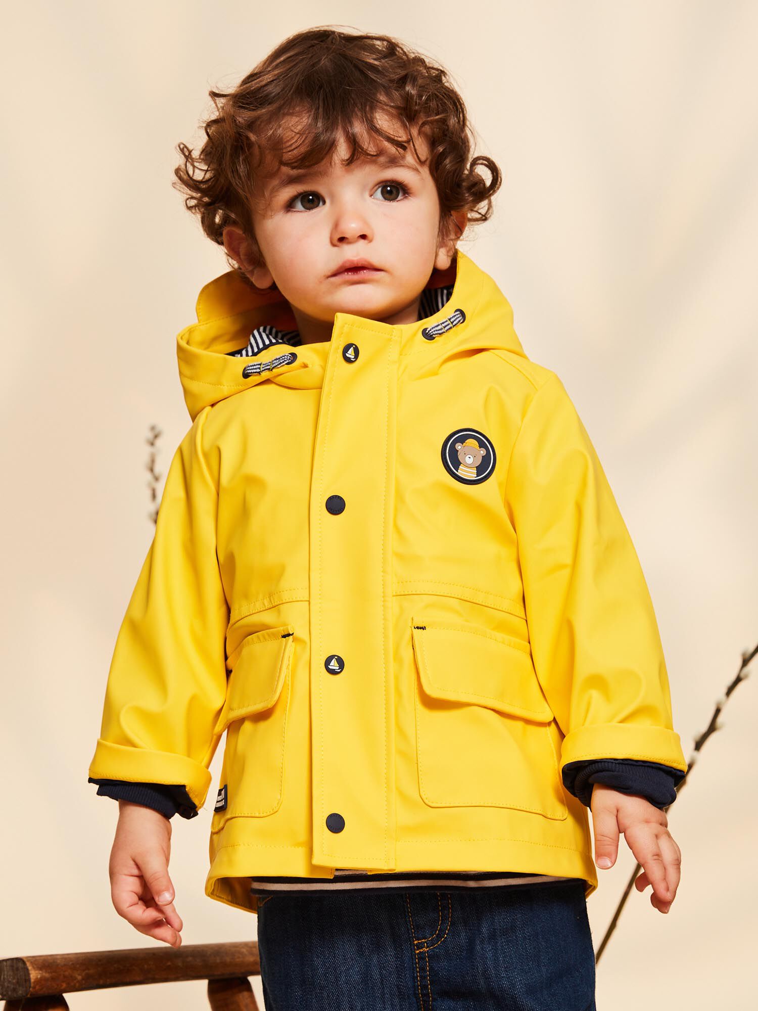 Yellow raincoat with blue striped lining store