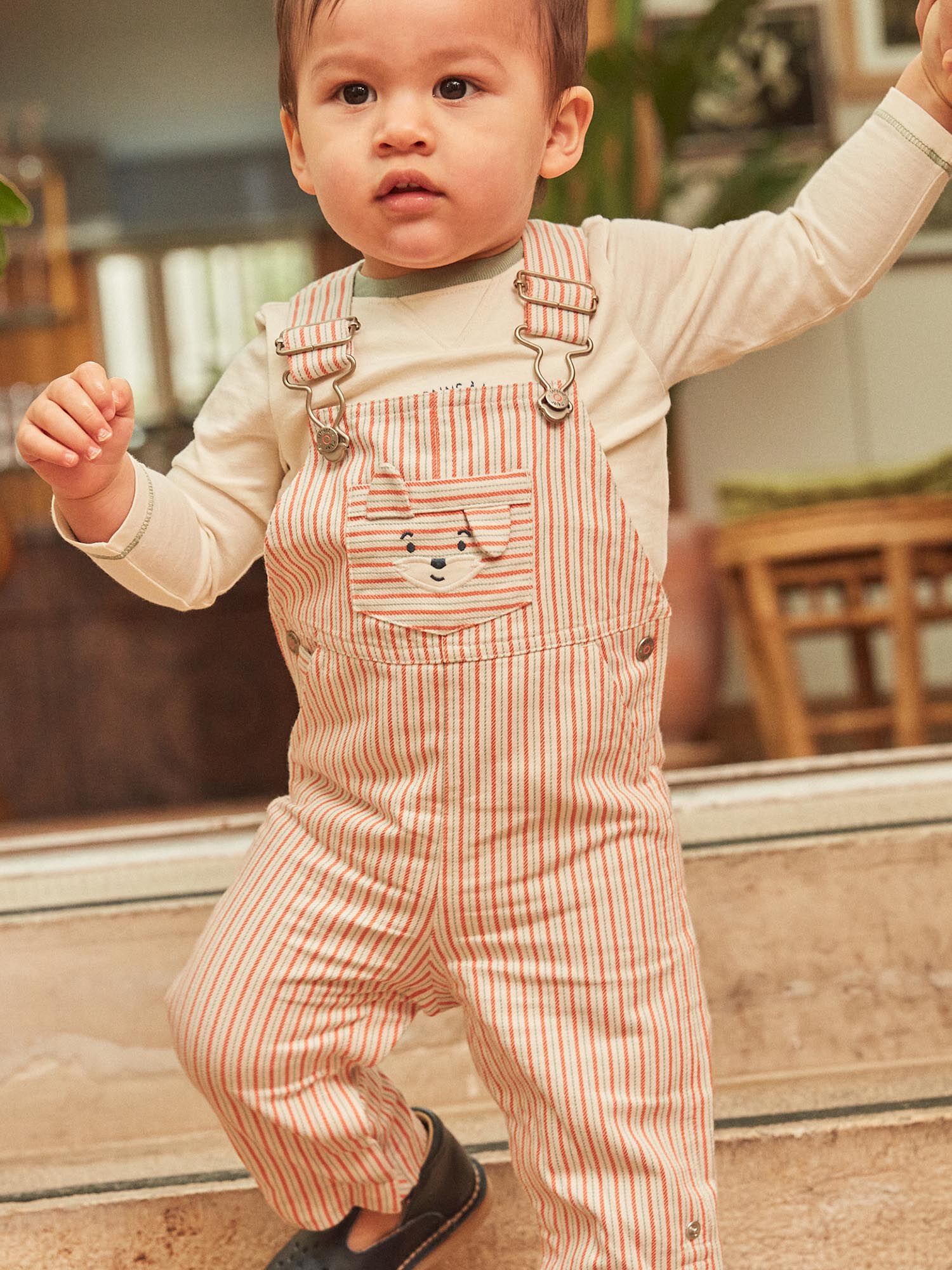 Baby boy in overalls top