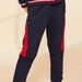 Navy blue jogging suit with red inserts