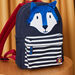 Canvas backpack with stripes and wolf animation