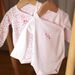 2 soft pinks bodysuits with floral and koala print
