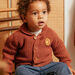 Baby boy earthy knit cardigan with sunny pattern