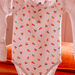 Baby girl's ecru peach print bodysuit