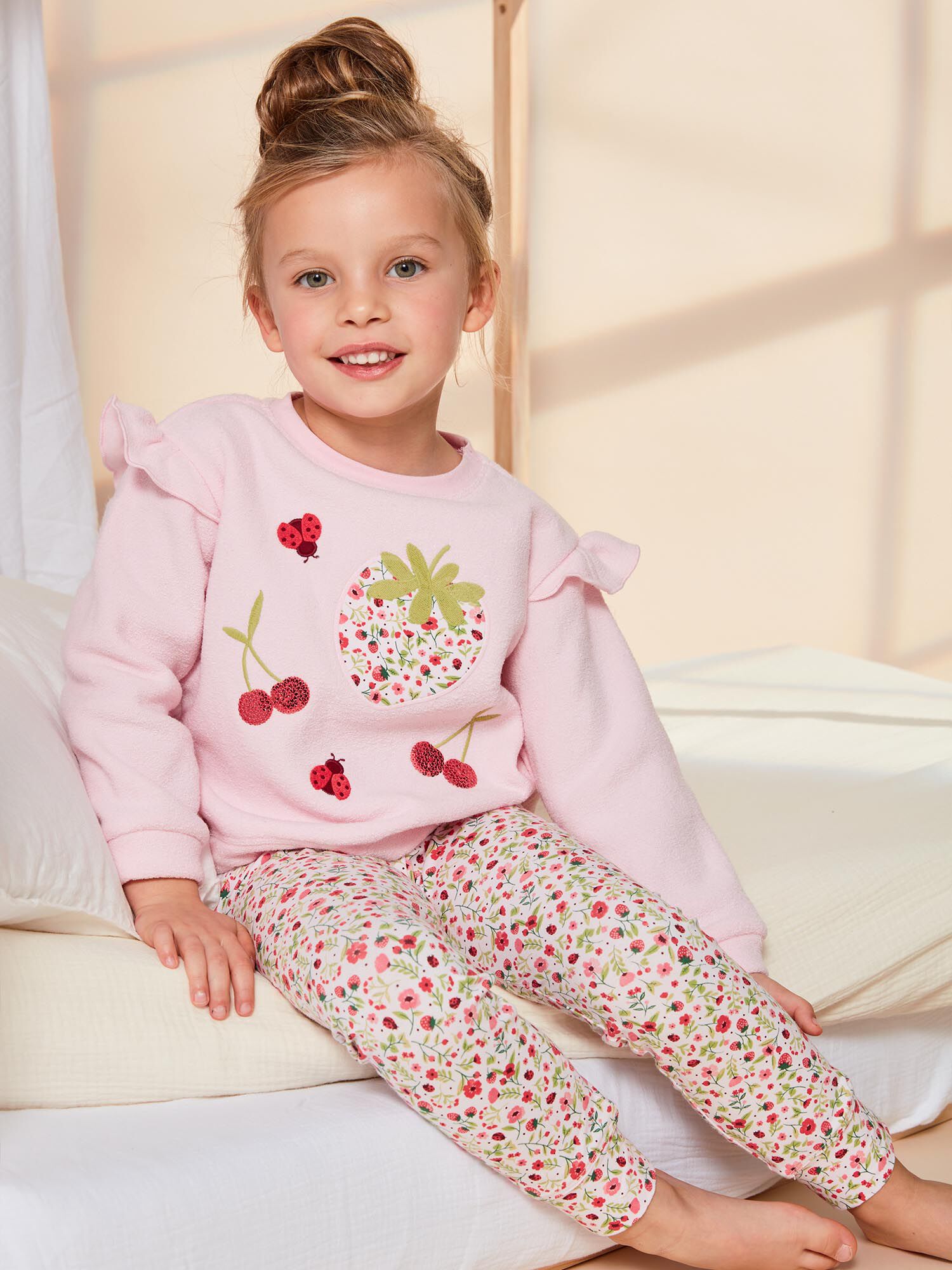 Pale pink pajama set with fancy print and patterns