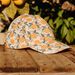 Multicolored cap with clementine print